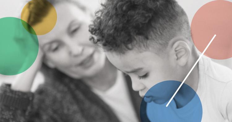 Black and white portrait of a child client and a therapist explaining to the child what does a pediatric occupational therapist do