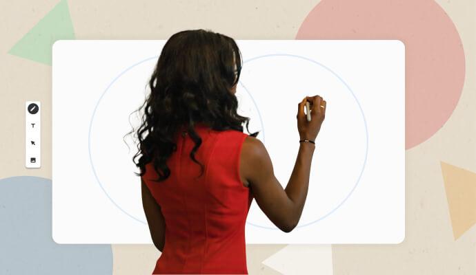 A woman stands in front of a whiteboard writing on it.