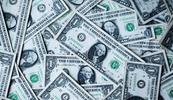 pile of U.S. dollars representing difference between costs vs investments