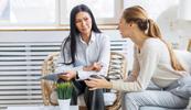 A therapist goes to therapy for herself, she sits next to her therapist who is listening intently.
