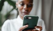 woman using phone to schedule mental health appointment
