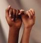 2 kids with pinky fingers interlaced expressing culturally responsive counseling