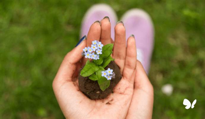 flowers in hand representing self-compassionate private practice owner