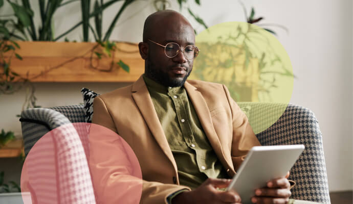 A therapist in his office uses his electronic tablet to look at the list of top mental health ICD-10 Codes for the year