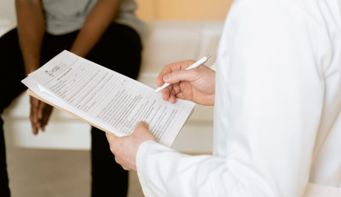 A doctor does an anxiety screening for a patient in primary care